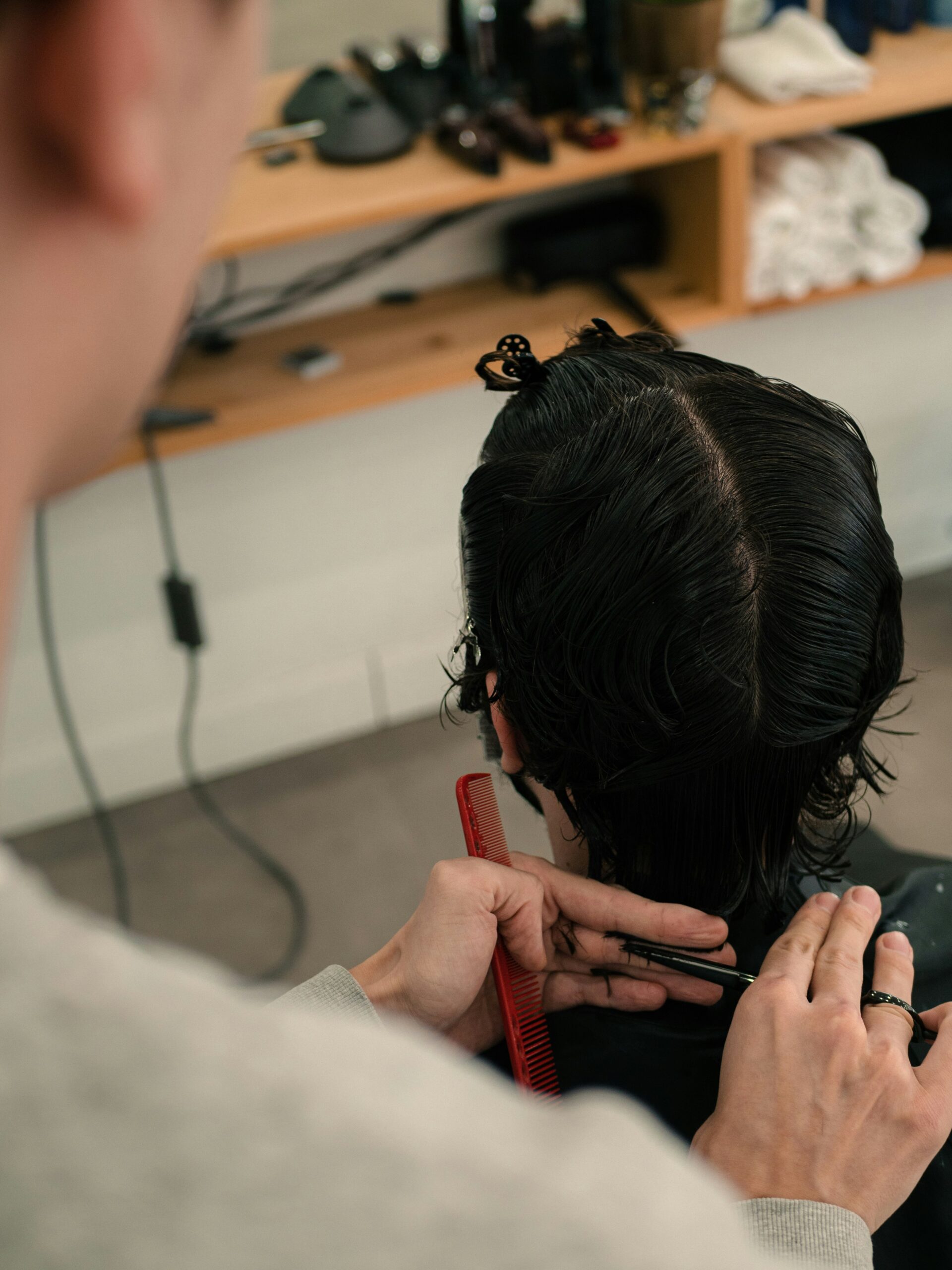 a man getting his hair cut in a salon