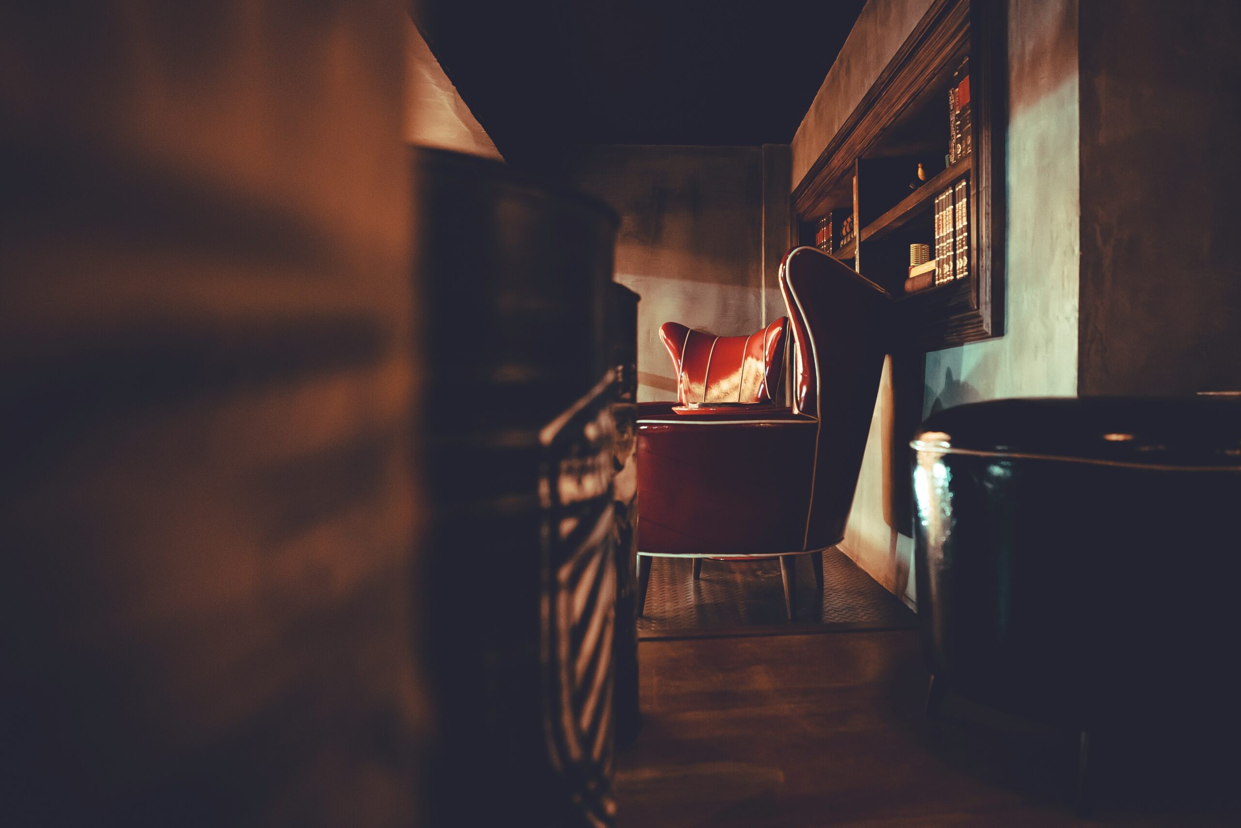 red sofa chair near window during daytime